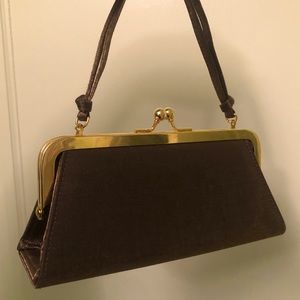 small green bag with clasp